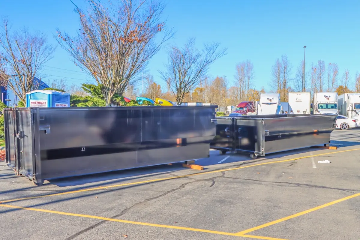 Professional dumpster rental service with roll-off container on residential driveway in Cimarron Hills