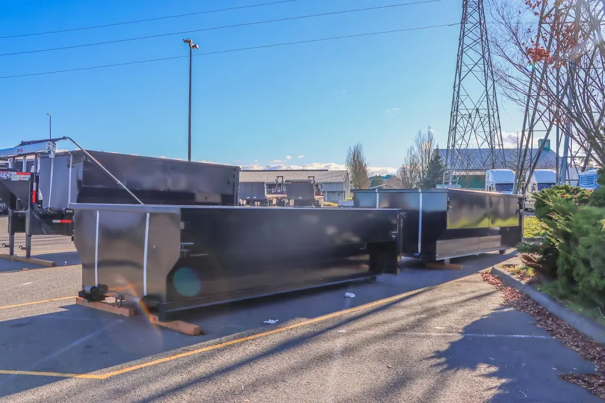 Roll-off dumpster ready for waste disposal at job site for 2 Yard Dumpster Rental in Cimarron Hills